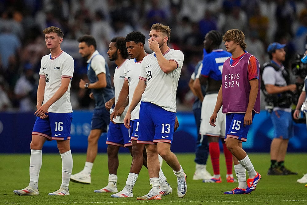 | Photo: AP/Daniel Cole : United States' Duncan McGuire reacts after the match against France
